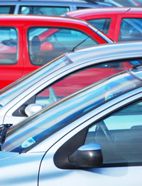 A photo of motor cars in a car park