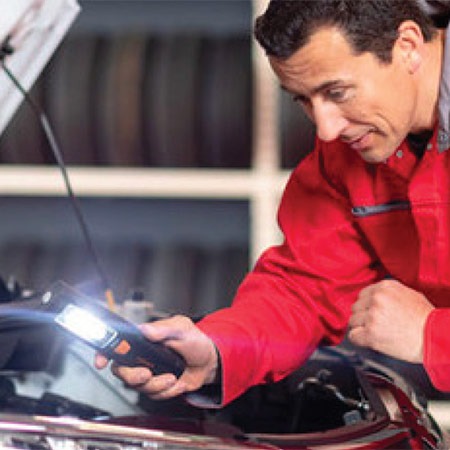 Experienced car technician at work