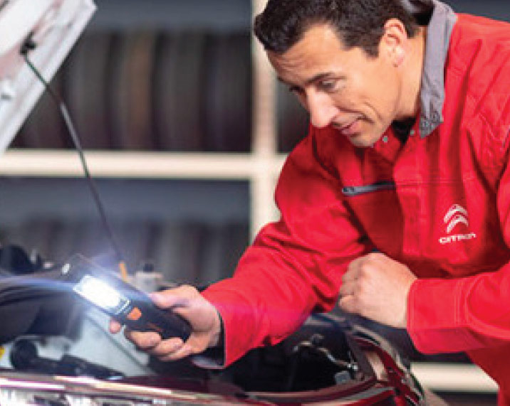 Citroen motor mechanic at work
