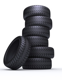 A photo of a stack of new tyres